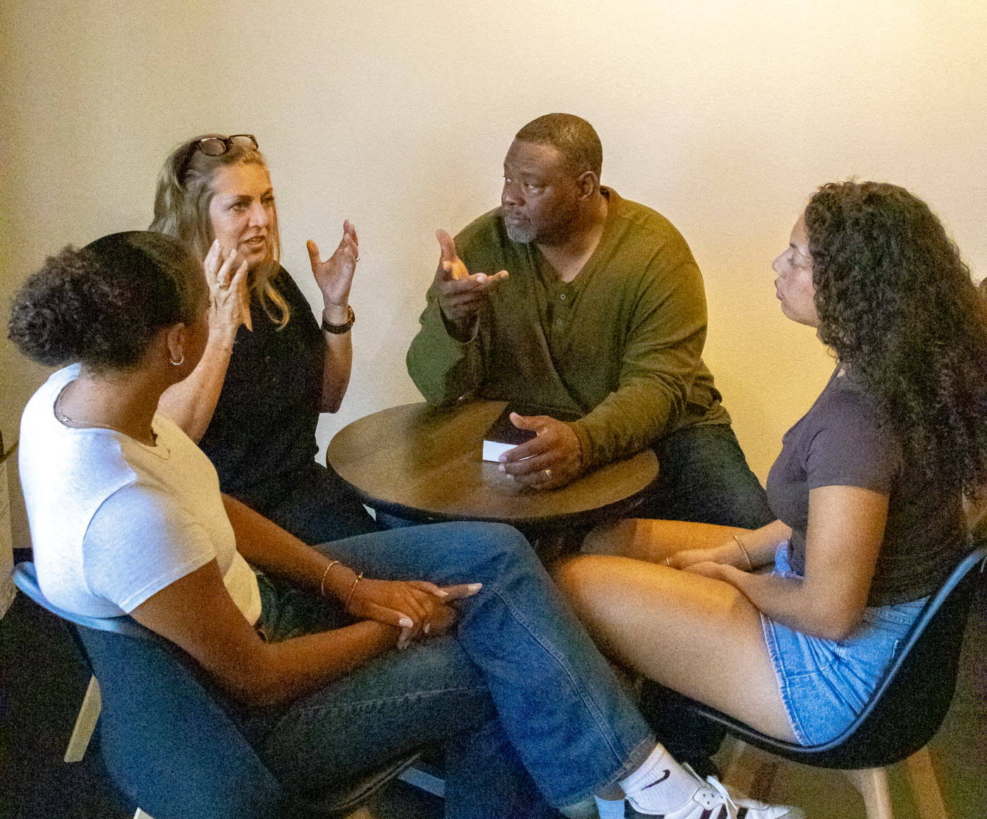 Gino and Michelle Mingo coaching a small group in conversation