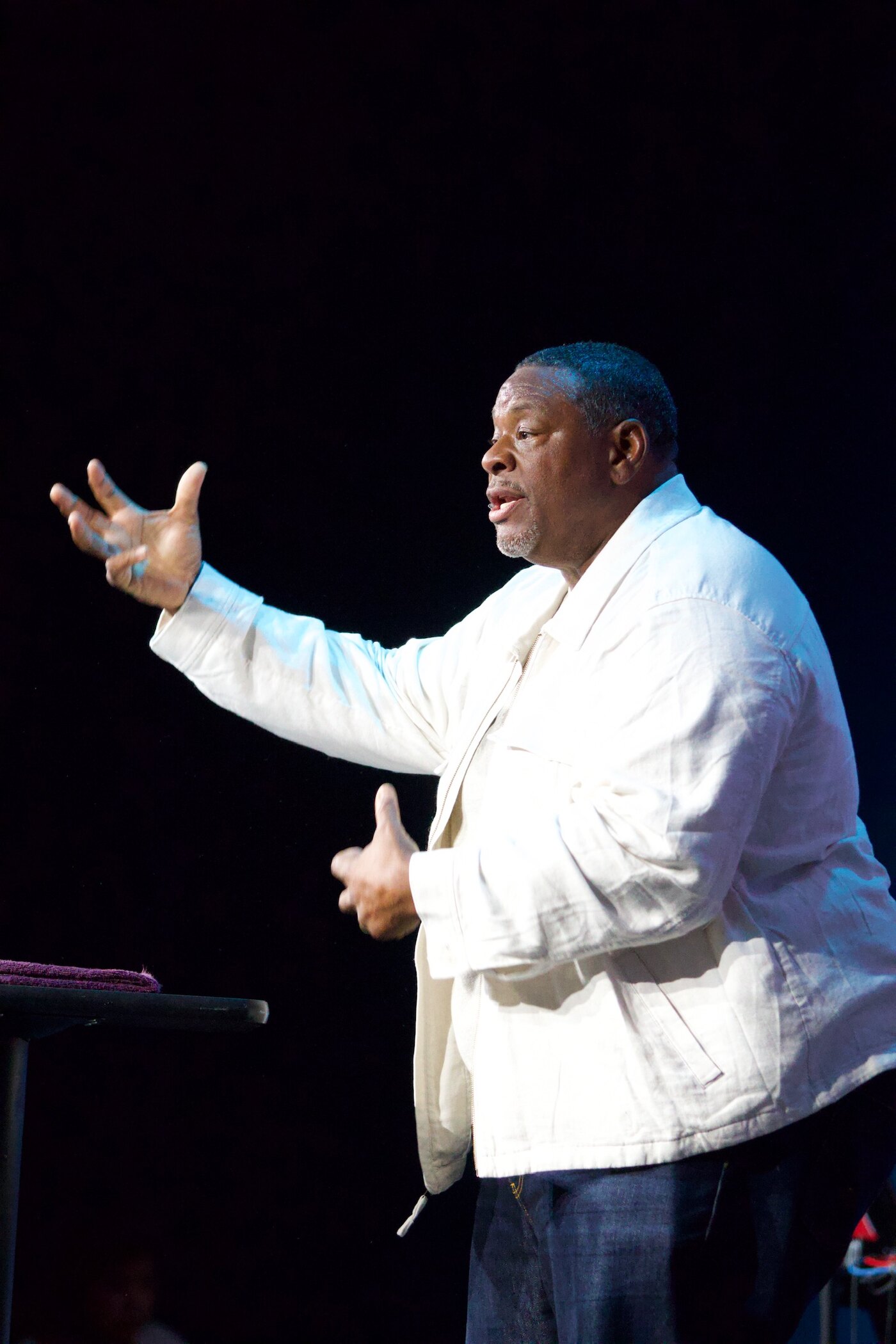 Gino Mingo speaking with an open hand