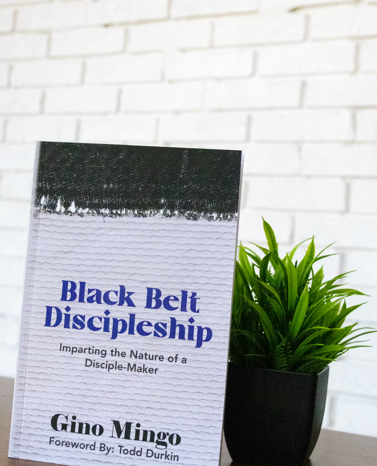 Black Belt Discipleship book placed on a table